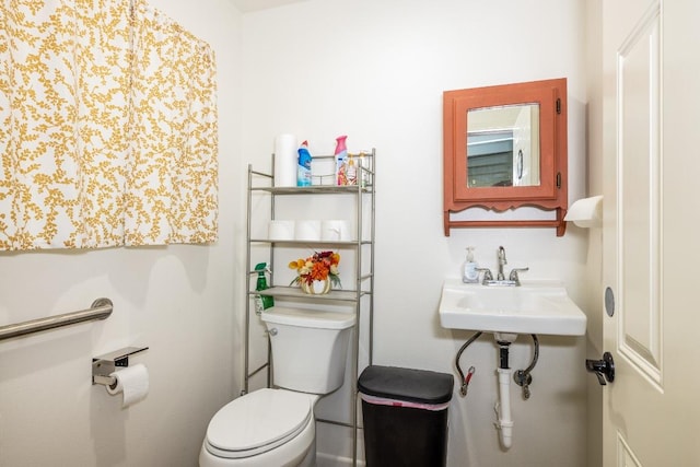110 Live Oak St, Gonzales, TX 78629 - half bathroom with toilet and a sink