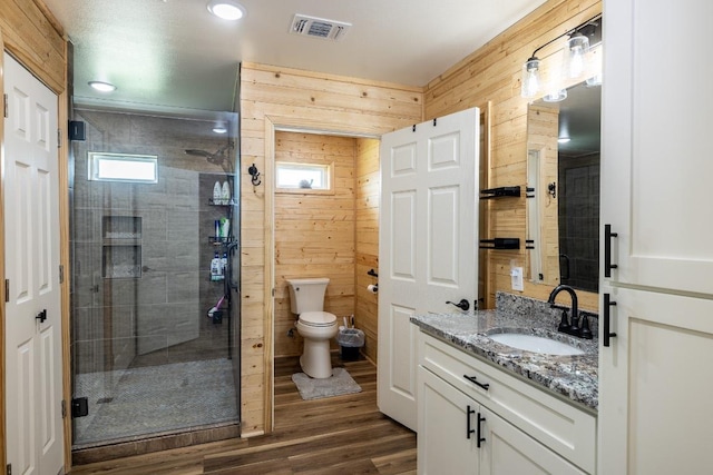 110 Live Oak St, Gonzales, TX 78629 - bathroom featuring vanity, wood finished floors, a shower stall, and toilet