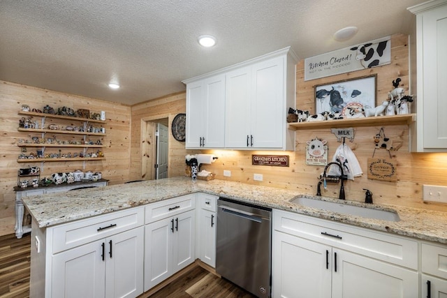 110 Live Oak St, Gonzales, TX 78629 - kitchen with a peninsula, a sink, a textured ceiling, open shelves, and dishwasher