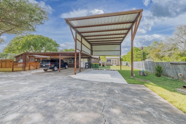 110 Live Oak St, Gonzales, TX 78629 - view of car parking with a storage shed and fence