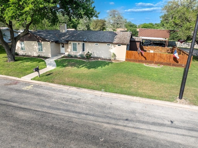 110 Live Oak St, Gonzales, TX 78629 - ranch-style home with a front yard and a chimney