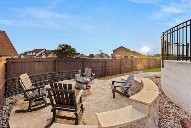 view of patio / terrace with a fenced backyard and a fire pit