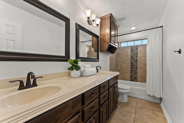 full bath featuring tile patterned flooring, visible vents, a sink, and double vanity