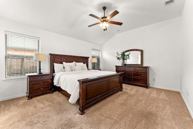 bedroom with multiple windows, visible vents, baseboards, and light carpet