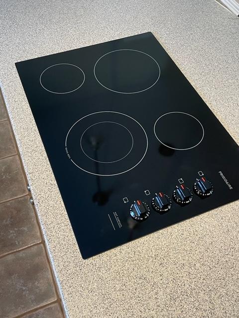 room details with black electric cooktop