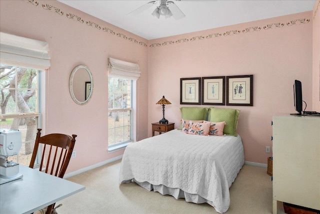 bedroom featuring carpet floors, baseboards, and multiple windows