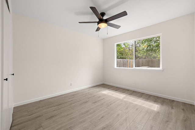 1337 Neans Dr, Austin, TX 78758 - spare room with baseboards, a ceiling fan, and wood finished floors
