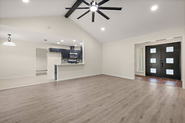 1337 Neans Dr, Austin, TX 78758 - unfurnished living room featuring beam ceiling, light wood finished floors, baseboards, ceiling fan, and recessed lighting