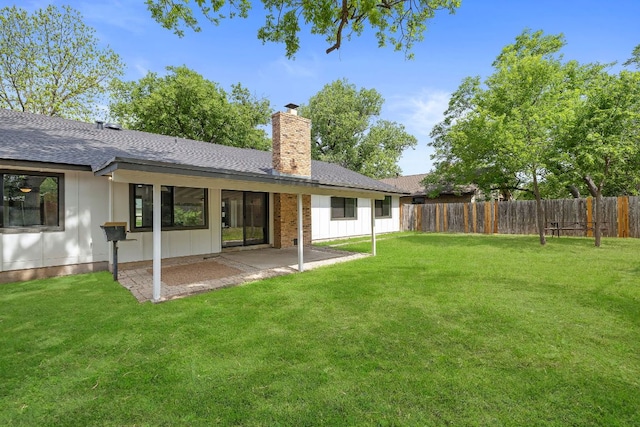 1337 Neans Dr, Austin, TX 78758 - back of house with a chimney, roof with shingles, and fence private yard