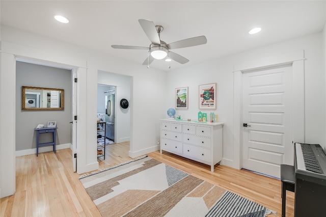 6307 Camino Real Unit 1, Austin, TX 78757 - bedroom with light wood-type flooring, baseboards, stainless steel built in fridge, and recessed lighting