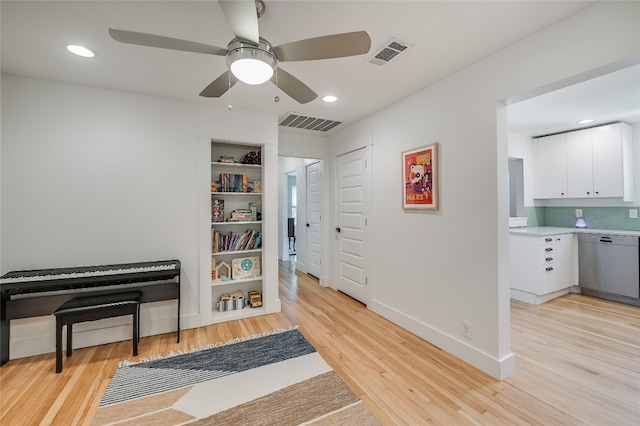 6307 Camino Real Unit 1, Austin, TX 78757 - interior space featuring baseboards, light wood-style flooring, visible vents, and a ceiling fan