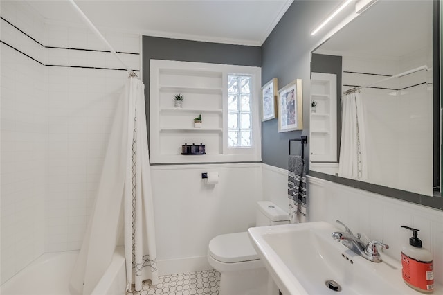 6307 Camino Real Unit 1, Austin, TX 78757 - bathroom featuring tile patterned flooring, toilet, ornamental molding, a sink, and shower / bath combo