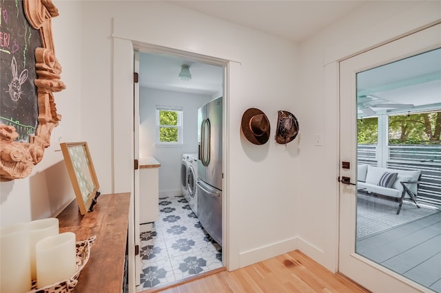 6307 Camino Real Unit 1, Austin, TX 78757 - interior space featuring washing machine and dryer, light wood-style floors, and baseboards