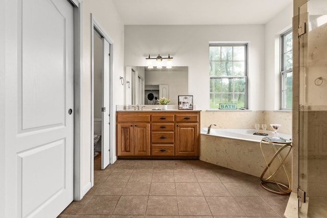 2800 Lomas Rodando Calzada Rd, Kempner, TX 76539 - full bath with a bath, vanity, tile patterned floors, toilet, and a shower stall
