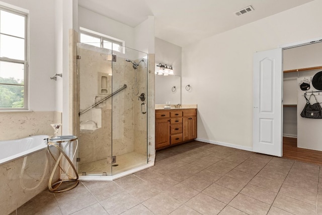2800 Lomas Rodando Calzada Rd, Kempner, TX 76539 - bathroom with vanity, a shower stall, a bath, and tile patterned flooring