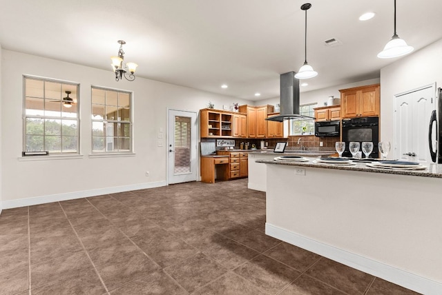 2800 Lomas Rodando Calzada Rd, Kempner, TX 76539 - kitchen with island range hood, black microwave, open shelves, a sink, and tasteful backsplash