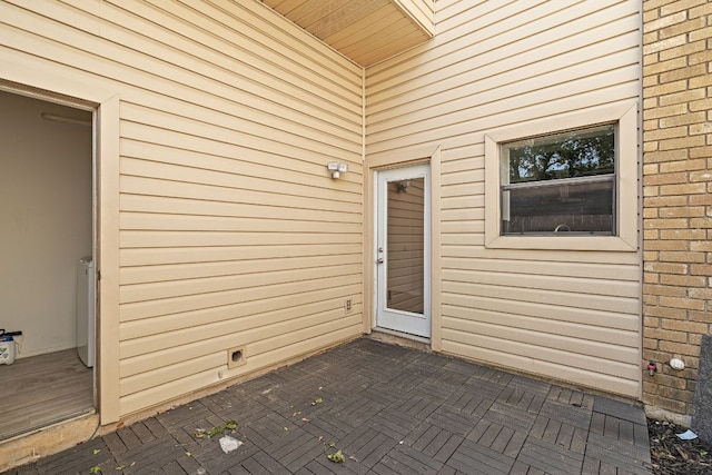 doorway to property featuring a patio
