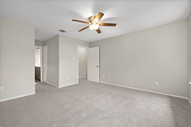 8400 Jamestown Dr Unit 410, Austin, TX 78758 - unfurnished bedroom featuring carpet floors, a ceiling fan, and ensuite bathroom