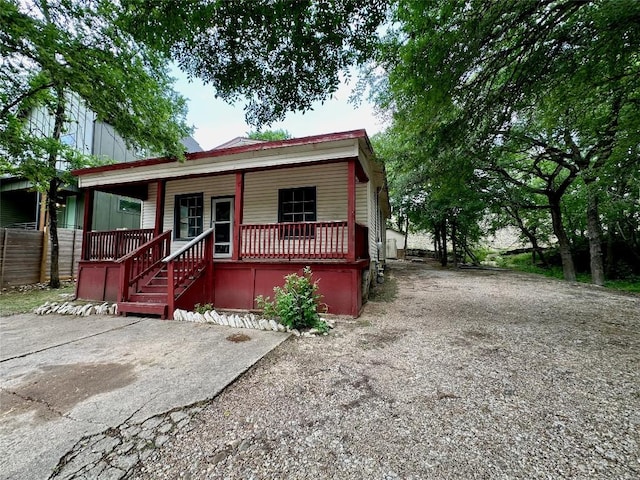 1221 Delano St, Austin, TX 78721 - view of front facade with a porch