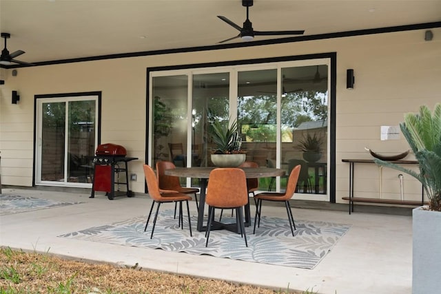 view of patio / terrace featuring ceiling fan, outdoor dining space, and a grill