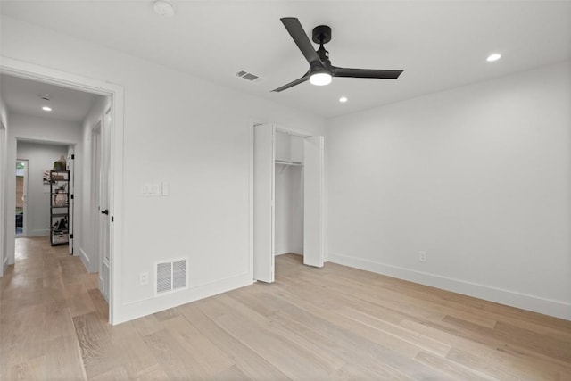 unfurnished bedroom featuring recessed lighting, light wood-style floors, and visible vents