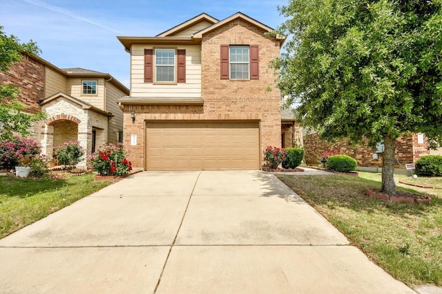 traditional-style home with an attached garage, driveway, brick siding, and a front yard