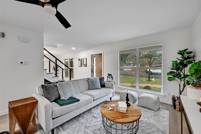 5000 Pack Saddle Pass, Austin, TX 78745 - living room featuring wood finished floors, stairs, ceiling fan, recessed lighting, and baseboards