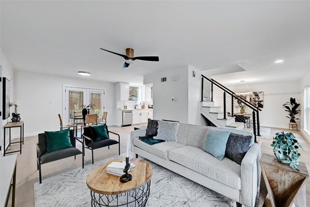 5000 Pack Saddle Pass, Austin, TX 78745 - living room with stairway, plenty of natural light, a ceiling fan, and baseboards
