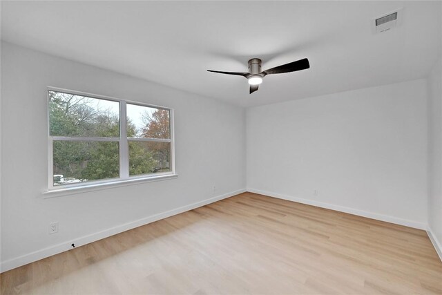 5000 Pack Saddle Pass, Austin, TX 78745 - empty room with a ceiling fan, wood finished floors, and baseboards