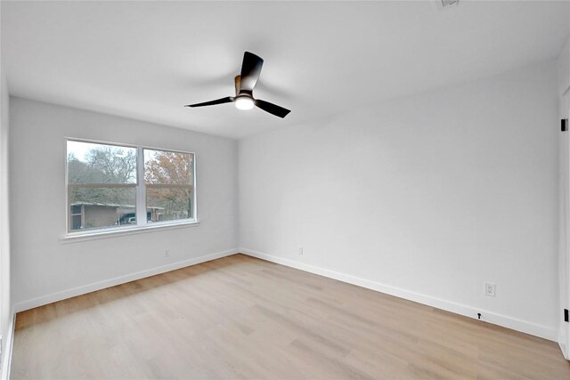 5000 Pack Saddle Pass, Austin, TX 78745 - spare room featuring wood finished floors, ceiling fan, and baseboards