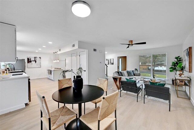 5000 Pack Saddle Pass, Austin, TX 78745 - dining area with light wood-type flooring, a ceiling fan, recessed lighting, and baseboards