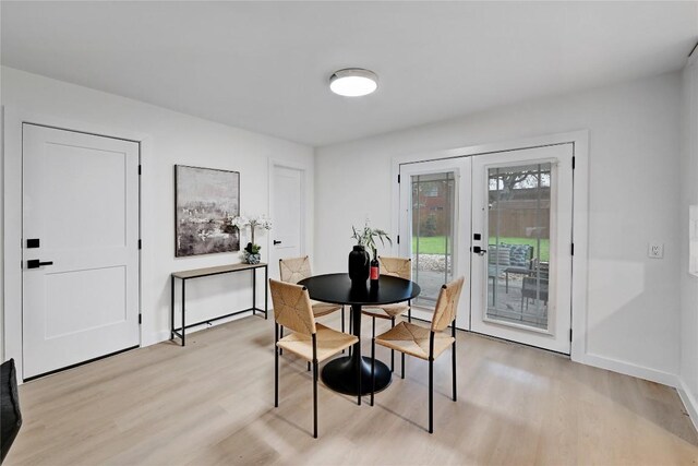 5000 Pack Saddle Pass, Austin, TX 78745 - dining room with light wood-style flooring, french doors, and baseboards