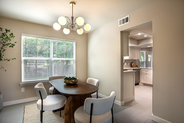 2011 Malvern Hill Dr, Austin, TX 78745 - dining room with plenty of natural light, a chandelier, and baseboards