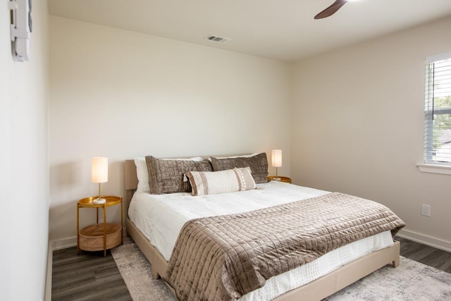 2011 Malvern Hill Dr, Austin, TX 78745 - bedroom featuring wood finished floors, baseboards, and a ceiling fan