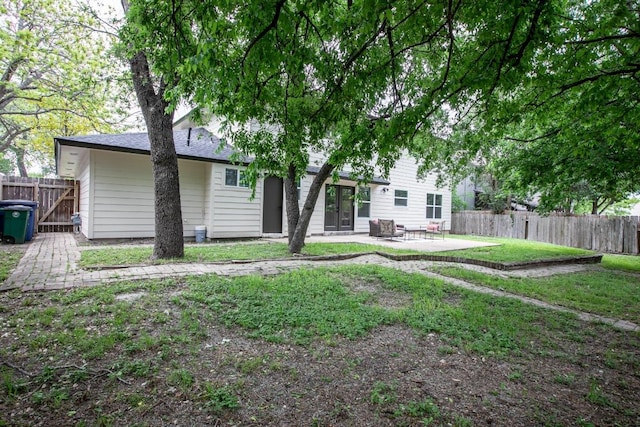 2011 Malvern Hill Dr, Austin, TX 78745 - rear view of property featuring a patio and a shingled roof