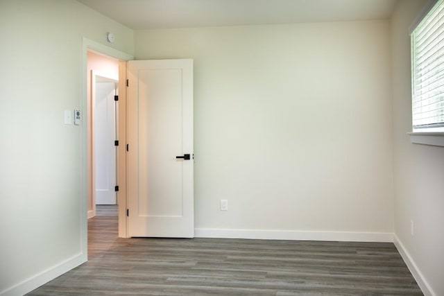 2011 Malvern Hill Dr, Austin, TX 78745 - spare room with wood finished floors, baseboards, and a smoke detector