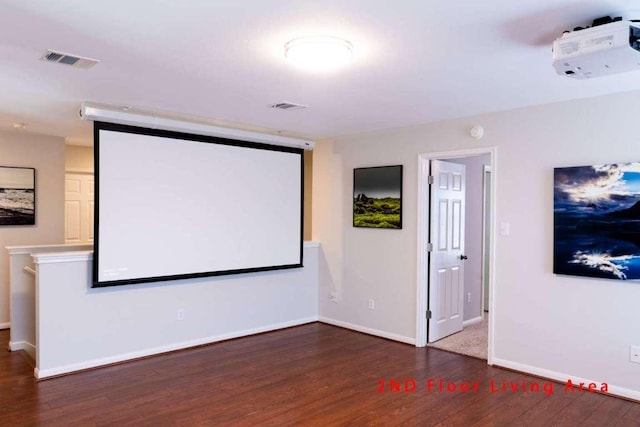 102 Buck Shot Ct, Bastrop, TX 78602 - home theater room featuring wood finished floors and baseboards