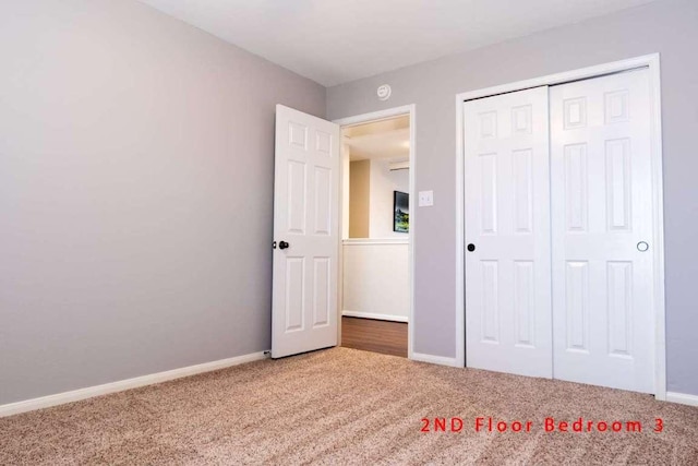 102 Buck Shot Ct, Bastrop, TX 78602 - unfurnished bedroom featuring carpet floors, baseboards, and a closet
