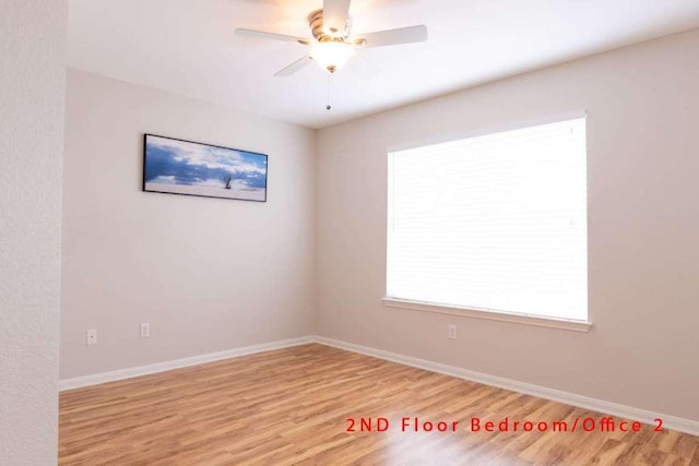 102 Buck Shot Ct, Bastrop, TX 78602 - spare room with light wood-style flooring, a ceiling fan, and baseboards