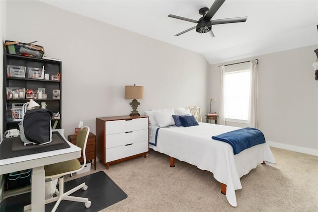 carpeted bedroom featuring ceiling fan, vaulted ceiling, and baseboards