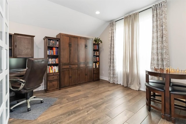 office area featuring recessed lighting, lofted ceiling, baseboards, and wood finished floors