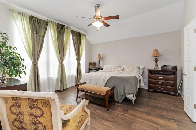 bedroom with lofted ceiling, ceiling fan, and dark wood finished floors