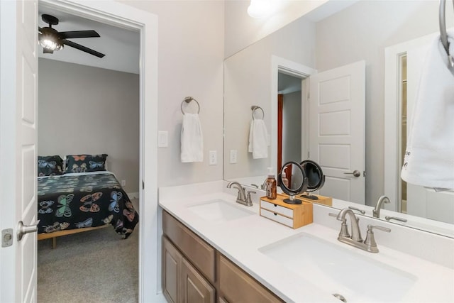 full bathroom with a ceiling fan, a sink, and double vanity
