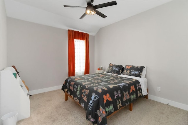 bedroom with ceiling fan, carpet floors, lofted ceiling, and baseboards