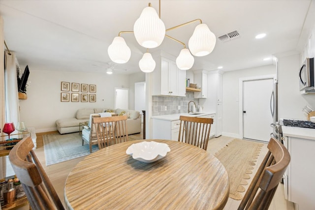 2602 Baxter Dr, Austin, TX 78745 - dining room featuring baseboards, ceiling fan, and recessed lighting