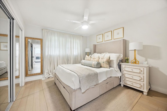 2602 Baxter Dr, Austin, TX 78745 - bedroom featuring a closet, light wood finished floors, a ceiling fan, and baseboards