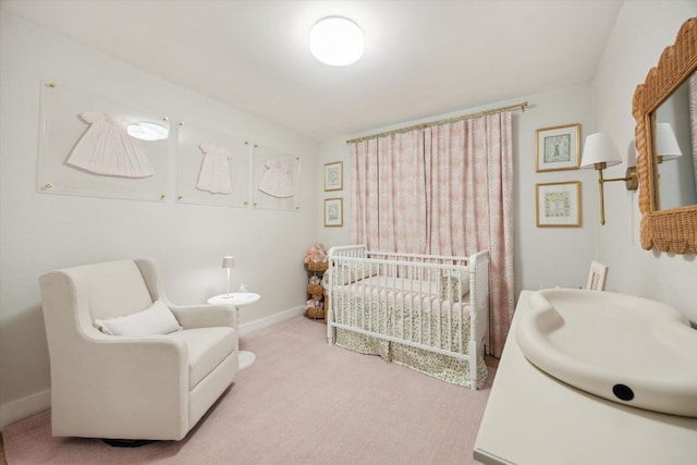 2602 Baxter Dr, Austin, TX 78745 - carpeted bedroom with a nursery area and baseboards