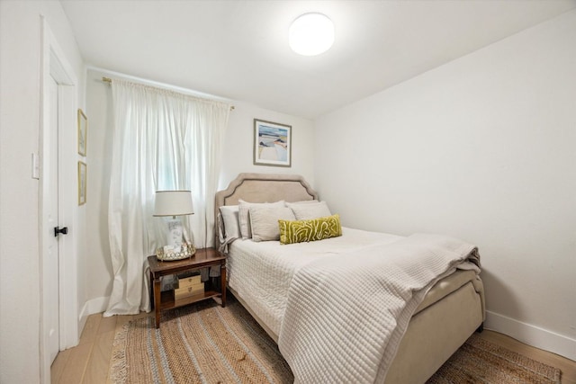 2602 Baxter Dr, Austin, TX 78745 - bedroom featuring wood finished floors and baseboards