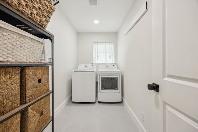 2602 Baxter Dr, Austin, TX 78745 - laundry area with washing machine and dryer, light tile patterned flooring, baseboards, and recessed lighting