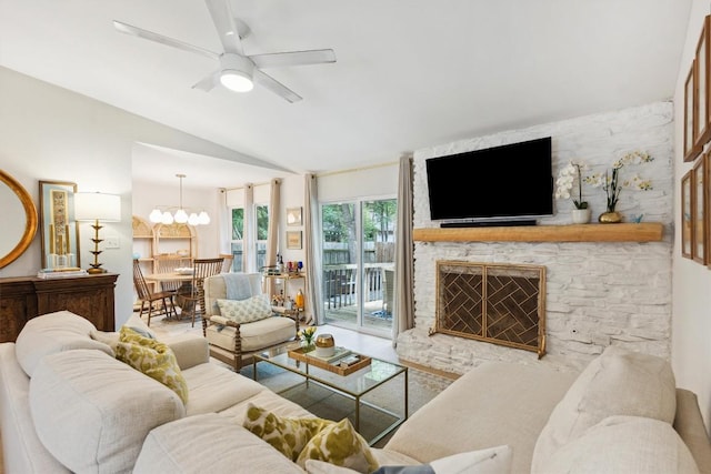 2602 Baxter Dr, Austin, TX 78745 - living room featuring lofted ceiling, a ceiling fan, a stone fireplace, and a chandelier